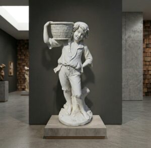 Concrete statue of a boy with a basket